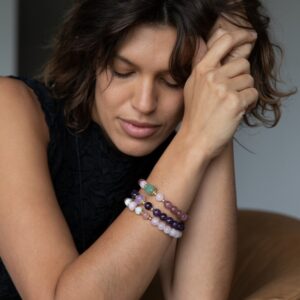 Lady wearing all Orgone Quintesse Bracelets